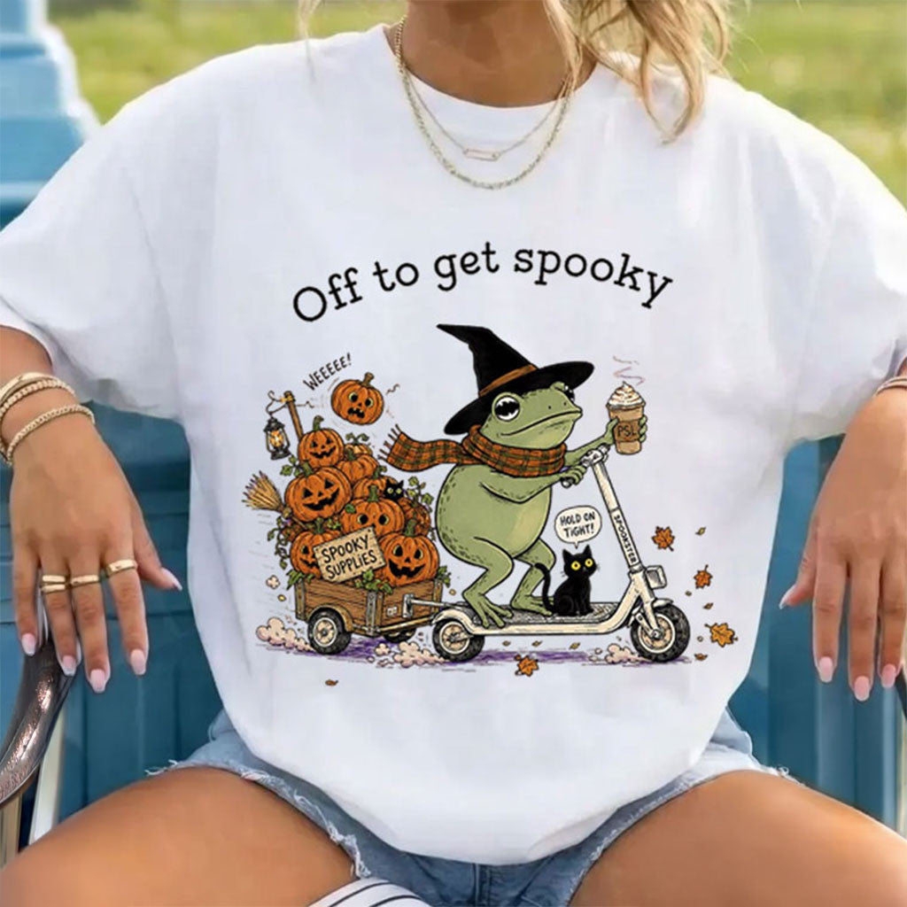 Off To Get Spooky Season Halloween Frog Riding Scooter T-Shirt Funny Halloween Shirt Gifts - Merchluma
