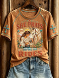 She Prays Before She Rides T-Shirt Christian Cowgirl Western Horse Shirt Faith Based Gifts - Merchluma