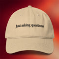 Tucker Carlson Merch 2026 Just Asking Questions Hat Embroidered Gifts For Friends - Merchluma
