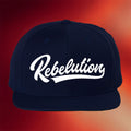The Rebelution Merch 2026 Cursive Logo Snapback Hat Navy Embroidered Gifts For Husband - Merchluma