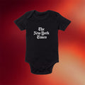 The New York Times Merch The Daily 2026 Stacked Logo Baby Onesie Black Best Newborn Gifts - Merchluma